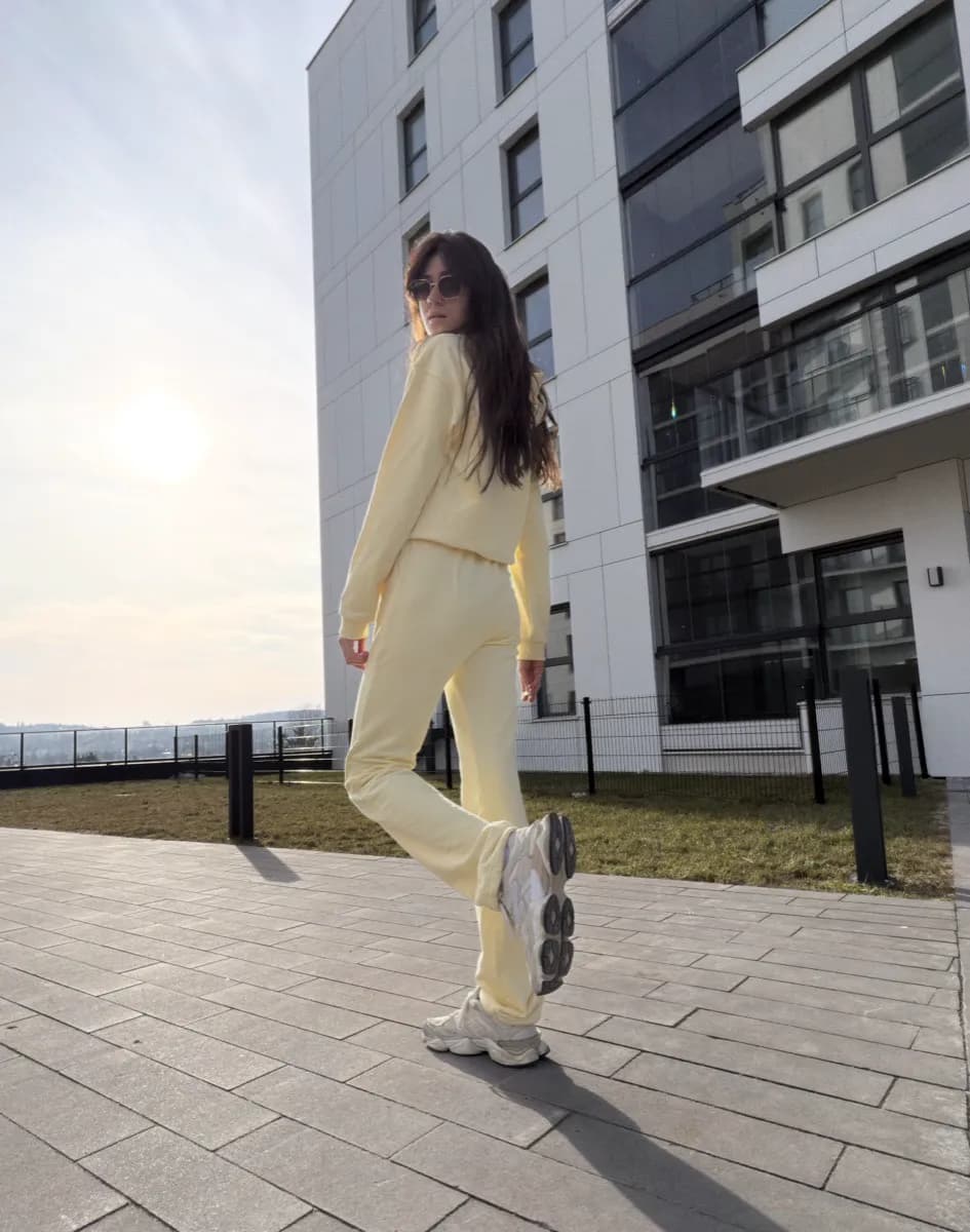 Tall woman wearing QORA premium tracksuit